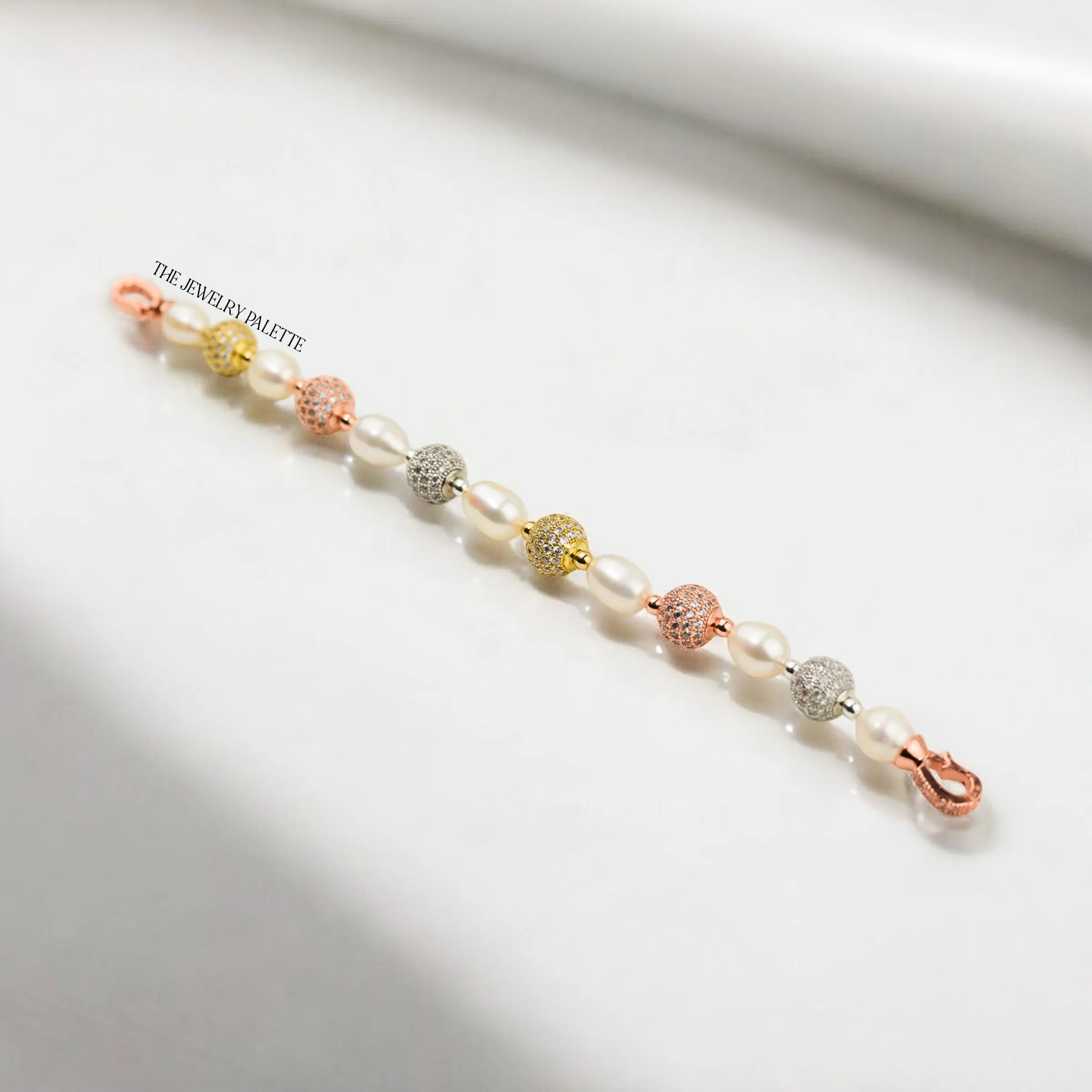 Fleur white freshwater pearl bracelet with gold, silver and rose gold accents