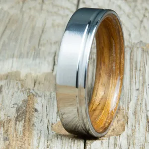 Polished titanium wedding band with Whiskey barrel interior