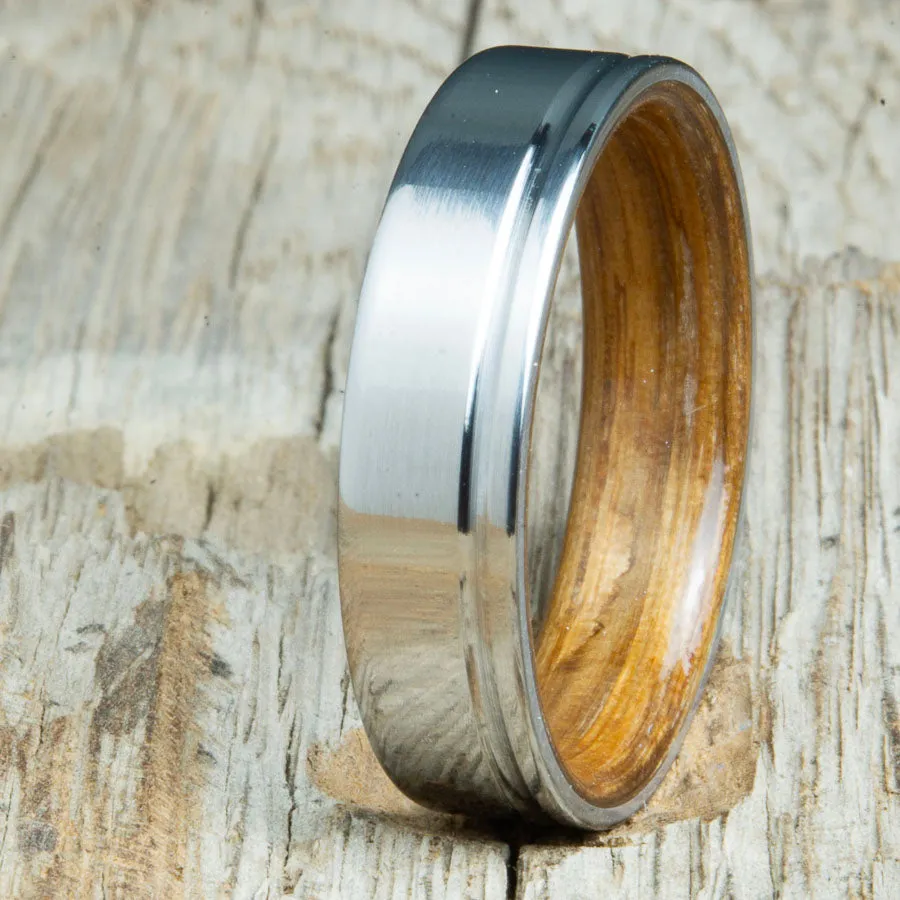 Polished titanium wedding band with Whiskey barrel interior