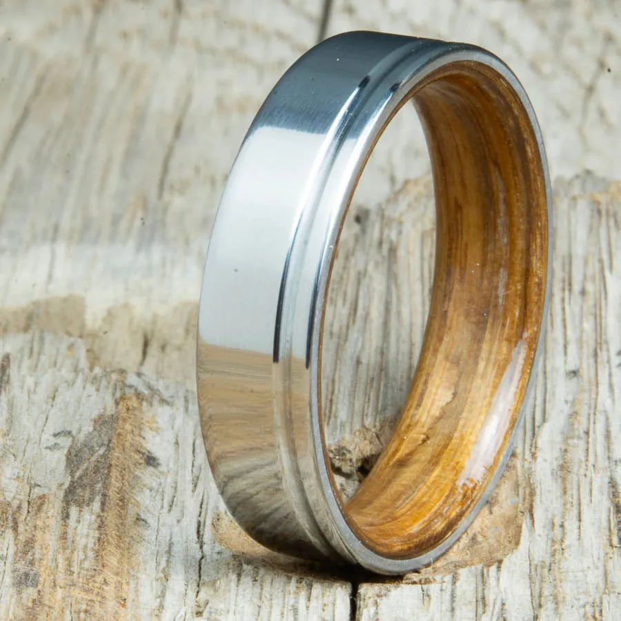 Polished titanium wedding band with Whiskey barrel interior