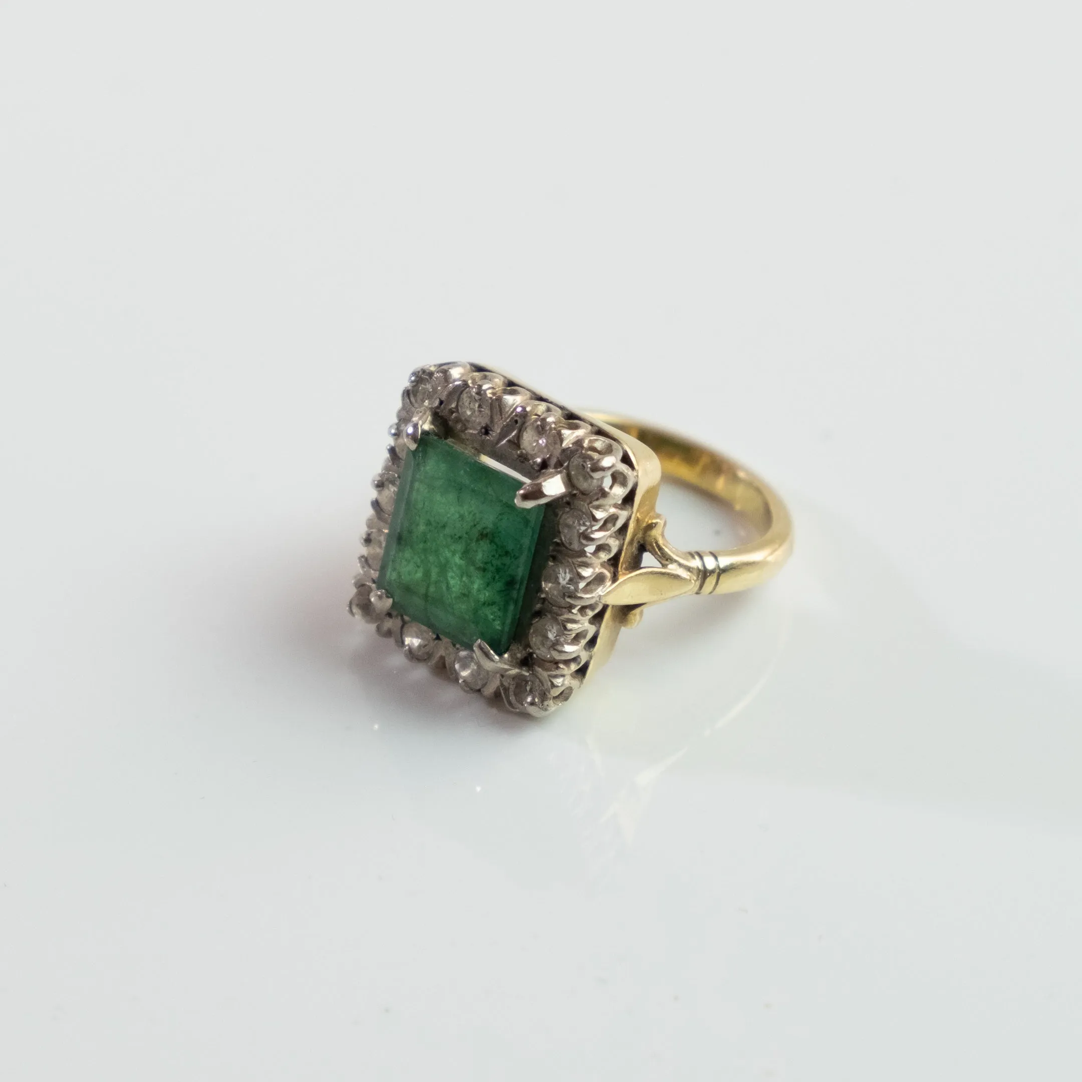 S O L D 1930, LONDON WHITE AND YELLOW GOLD EMERALD AND DIAMOND CLUSTER RING